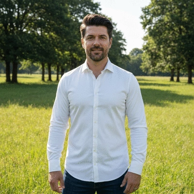A man with a healthy head of hair, looking confident, in a natural outdoor setting, no text, no words, no typography, clean image