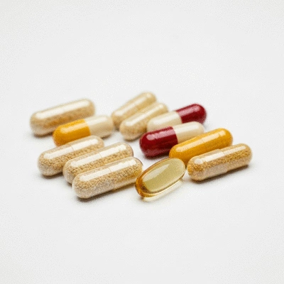 Assortment of natural nutritional supplements for hair growth on a clean background